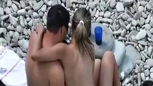 Mutual masturbation on a nude beach