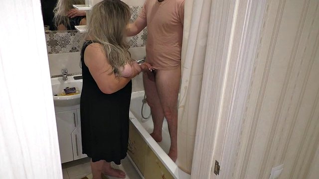 Stepmom got excited when she jerked off his cock in the bathroom and gave a blowjob before she asked to fuck her