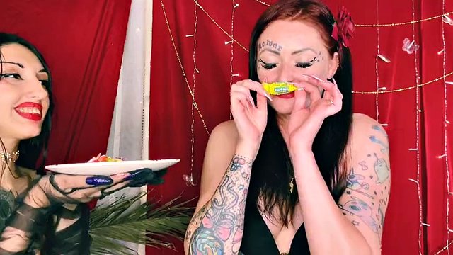 Food fetish. Two beauties eat sweets and kiss each other. Sweet spit, chew, fetish