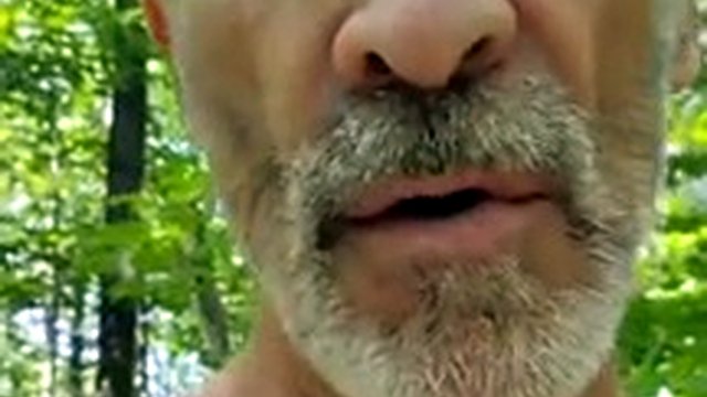 Dad takes a walk in the woods, strokes his cock and makes his balls bounce outdoors.