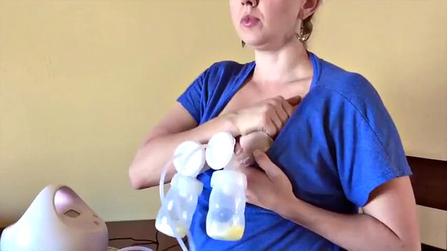 homely milf shows how to pump milk out of both tits
