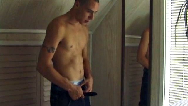 This tattooed hottie wants us to watch him jerk off. Bradley walks in and immediately takes charge of the task at hand. He starts a porn video, oils up his cock and squirts a healthy load of cum on a mirror.