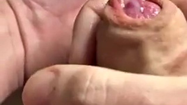 Extreme closeup playing with foreskin and piss, then wanking a string of thick cum into my hand