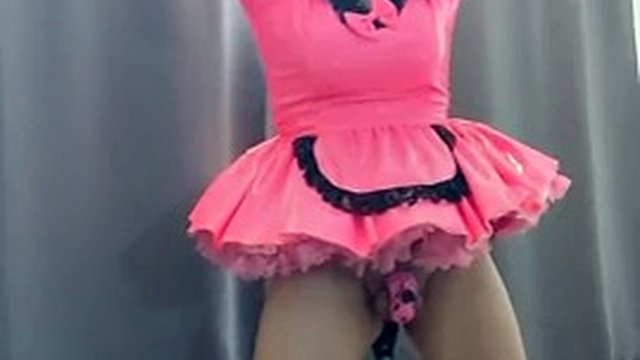 Sissy Maid in Hot Pink Dress and Chastity Is Locked to Her Dildo Stand