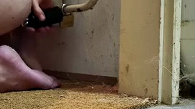 Chastity butt plug chained to radiator with ice lock