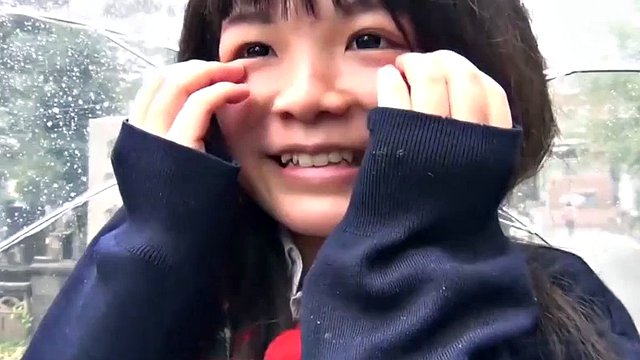 Cute Japanese girl pleases with a vibrator in the rain