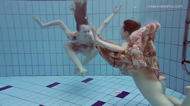 slim euro girls lada and anna swim naked in a pool