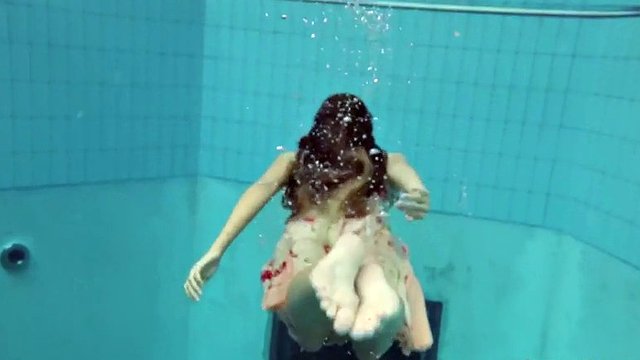 lucy takes the dress off showing her hairy pussy and titties underwater