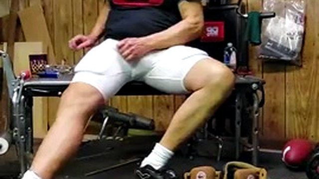 Football coach wearing a belt without a protective bandage