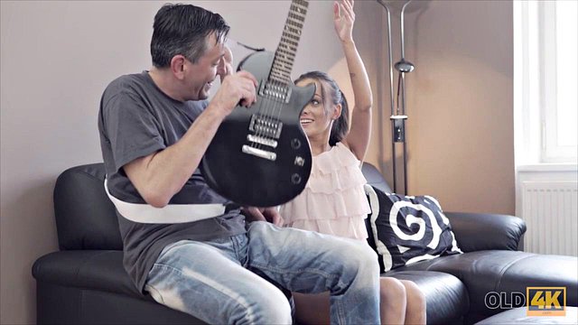 Teen Brunette Gets Close with Mature Guitarist
