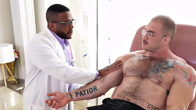 Muscular hunk masturbated by a black doctor with a muscle fetish
