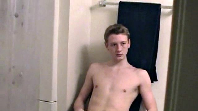 Sitting on the toilet, shirtless Corbin works his cock in his pants. Then he tugs on his jeans and boxers before he's fully hard, giving us the pleasure of watching him lube his semi and get stiff.