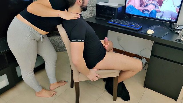 Mature stepmom jerks off her stepson while watching porn