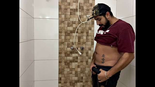 Squirting cum, bearded man with a cap alone in the bathroom having fun in the handjob until he cums a lot - Rodrik Dick