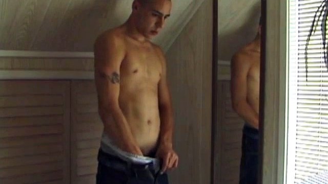 This tattooed hottie wants us to watch him jerk off. Bradley walks in and immediately takes over the task at hand. He starts a porn video, oils up his cock and squirts a load of cum on a mirror.