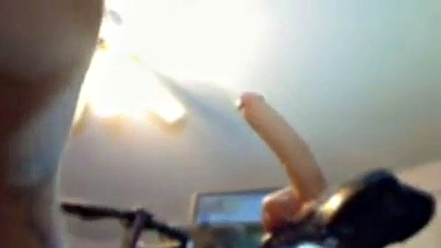 blonde riding a huge dildo on a bicycle on webcam