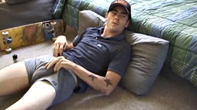 Dan lays down on the floor and starts watching a porn video. He goes right on his cock and plays with himself until he's boned. Rolling his head with his palm, Dan lubricates his hot cock.