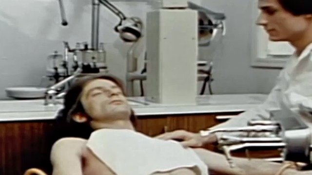 Gay patient masturbates while a hot doctor fucks him with a dildo