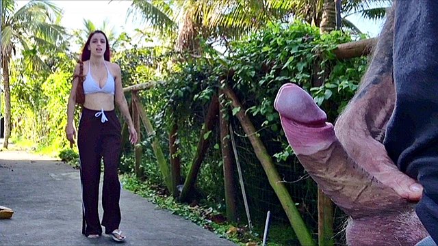 Risky handjob for hot redhead on the walk in the park in public!