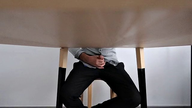 I catch my office colleague masturbating under the table and