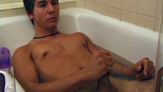 Brock is spending time, in the bathtub, reading a magazine and stroking his cock. After stroking himself several times, it doesn't take long for him to spit a hot load of cum all over his face.