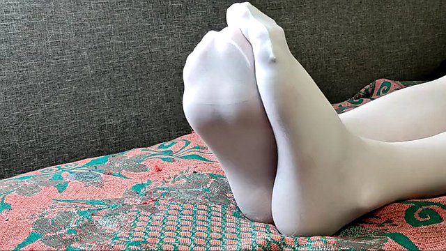 Ilandis shows her feet in white pantyhose