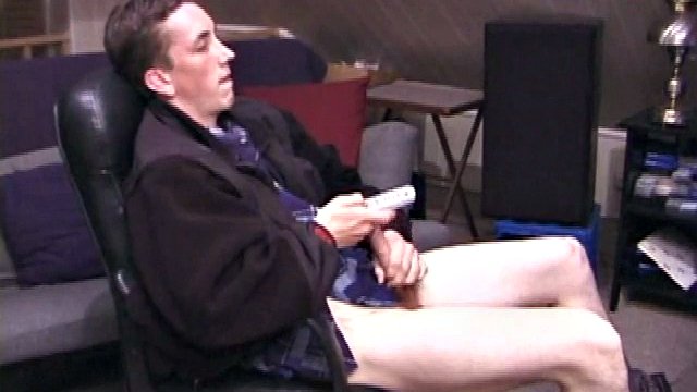 When Derek pulls his pants down, his hard cock sticks out and he starts stroking it. He obviously enjoys watching porn videos because Derek soon pumps his warm cum all over his stomach.