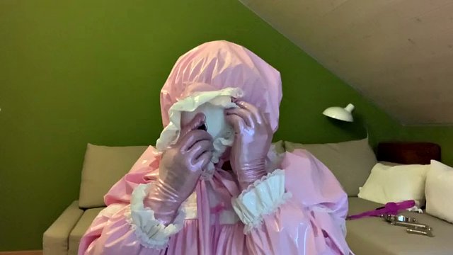 Sissy in diaper with bondage hood