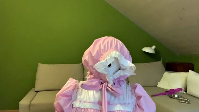 Sissy in diaper with bondage hood