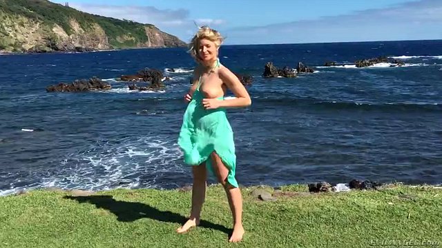 gorgeous blonde anikka albrite posing among cloud-shrouded mountains