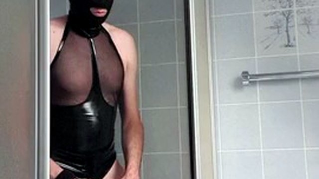 Latex Enema Slave plays with an inflatable anal plug