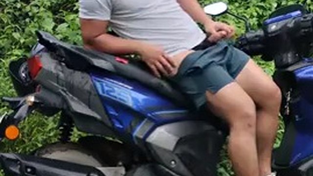 Wet and rainy masturbating in shorts and undressing near the road in a scooter near the women's police station. Nervous cock